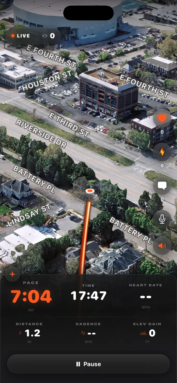 Your screen while you’re live: the LIVE badge, the satellite city in 3D following you down East Fourth Street in Chattanooga, the trail behind you, pace 7:04, 1.2 miles in 17:47